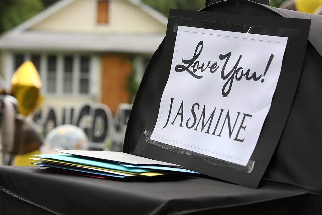Friends and family drop off graduation cards for Jasmine-Kay Johnson during the graduation parade